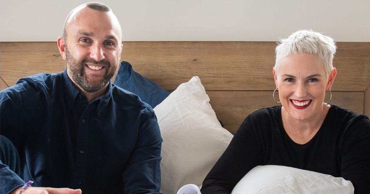 man and woman with pillows